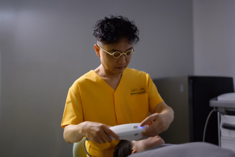 A member of clinical staff preparing equipment before a treatment